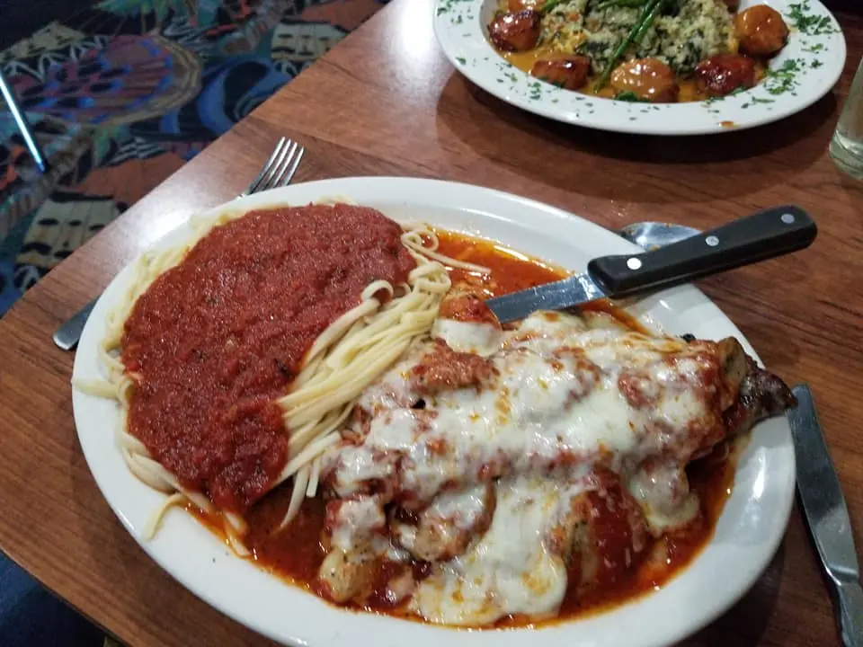 Chicken Parmigiana with melted cheese, tomato sauce and spaghetti at Golden Pyramid.