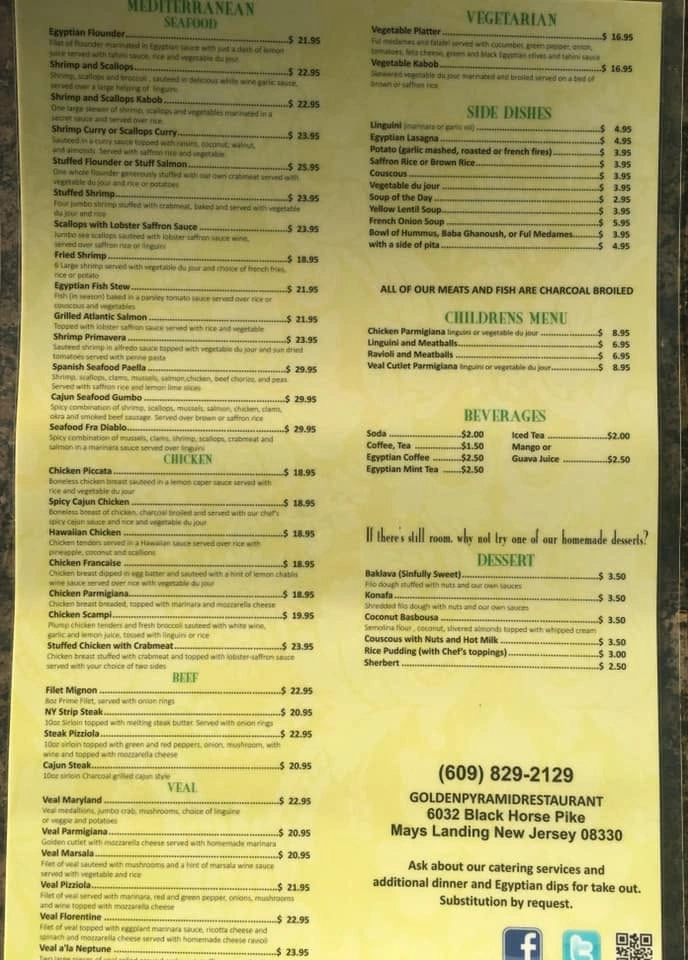 Golden Pyramid menu photograph with seafood, chicken, beef, veal, vegetarian dishes, sides, children's meals, drinks and desserts. The bottom edge is cropped.